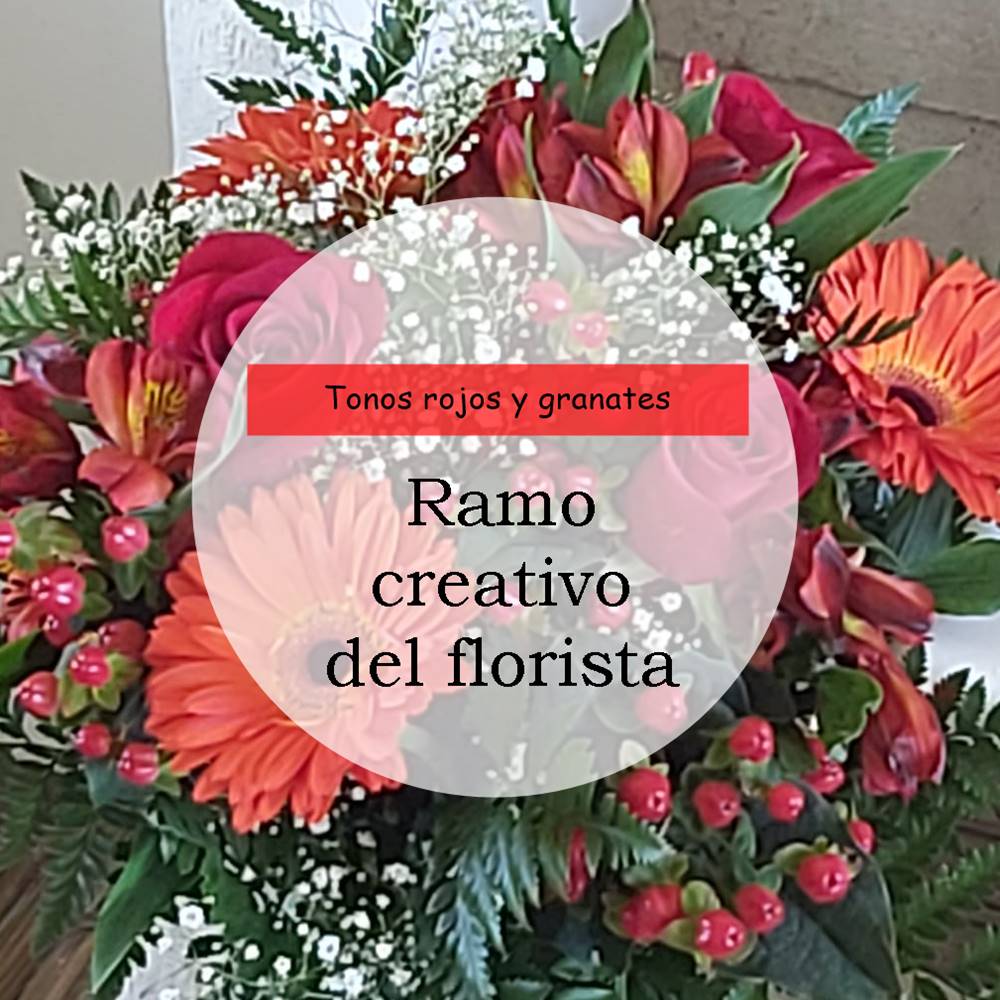 Ramo creativo del florista en tonos rojos y granates